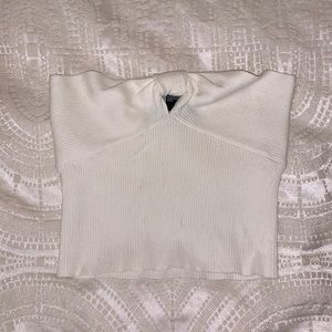 White crop top with small opening at front